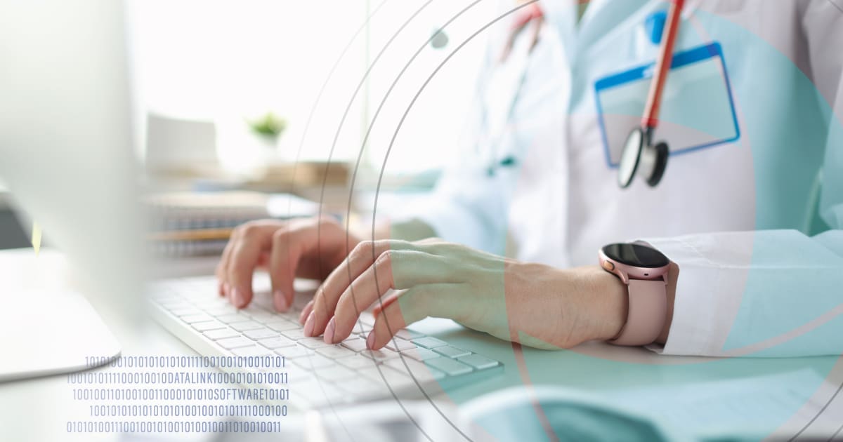 Doctor typing on computer